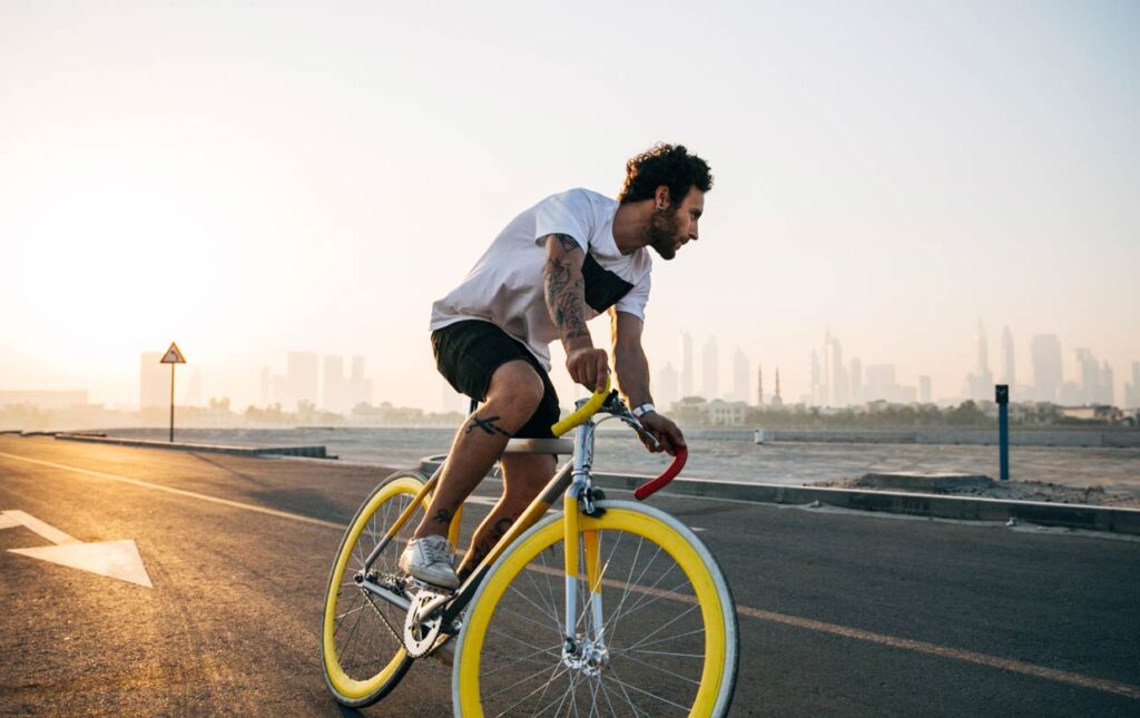 Man riding a bicycle to meet his cycling goals