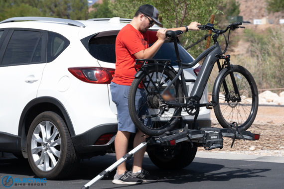 Thule EasyFold XT Review 2022 - rolling bikes into place with the included ramp